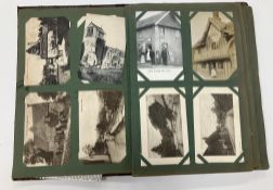An early 20th Century leather covered postcard album and contents of various postcards including