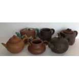 A collection of six Yi Xing tea pots, five with various seal marks, one stamped ''Russell 2004-