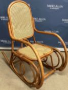 A modern Malaysian bentwood and caned rocking armchair in the manner of Michel Thonet 57 cm wide x