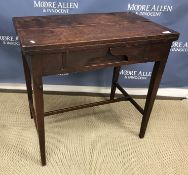 A 19th Century mahogany campaign tea table, the double fold-over top opening on to lopers, over a