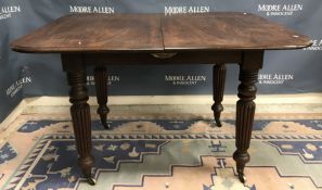 A 19th Century mahogany dining table in