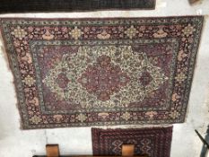 A vintage Persian rug, the central panel