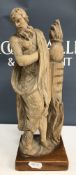 A 17th Century carved limewood figure in