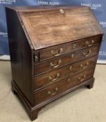 A George III mahogany bureau, the slopin
