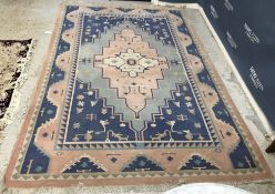 A Kelim rug, the central panel set with