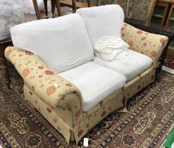 A modern floral upholstered two seat sof