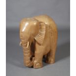 A large mahogany carved elephant, mid 20th century stamped SBH to one side, 52cm long x 33cm wide