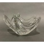 Daum, France (20th/21st century), a clear crystal organic style bowl, etched 'Daum France', 23cm