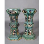 A pair of green and blue glazed stoneware jardinière stand of pierced chinoiserie style, 88cm