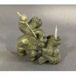 Inuit Carving - Walrus Hunt: Inuit and walrus by Jimmy Petalaussie 2002, Cape Dorset mottled green