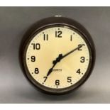 A Gents of Leicester electric wall clock c.1970 in dark brown enamelled metal case, cream dial