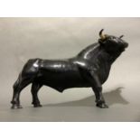A figure of a black bull, 32cm wide x 22cm high