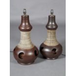 A pair of 1970s brown glazed pottery table lamps, pierced baluster shape, 58cm high