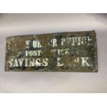 A dark blue and white lettered 'Money Order Office, Post Office and Savings Bank' sign, worn with