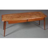 A teak coffee table, c.1960/70s, rectangular with two opposing drawers on rounded and splayed