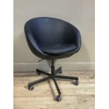 A black leather effect swivel tub chair on five point base