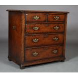 A Titchmarsh and Goodwin oak chest of two short and three long graduated drawers with brass back