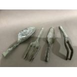 Four Verdigris finished garden tools: trowel, spade, grubber and narrow trowel