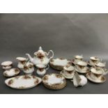 A Royal Albert Old Country Rose tea service comprising tea pot, two jugs in graduated size, sugar