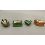 Four Limoges china trinket boxes, heart shape, egg shape, lozenge shape and rectangular, each hand