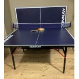 A Donnay table tennis table, ping pong balls and bats
