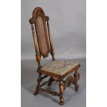 A 17th century style walnut and bergere single chair having an arched back with moulded and