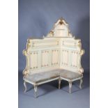 A French cream and gilt corner banquette, the raised back having an open compartment with shelves to