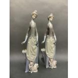 A pair of Lladro figures of a girl with parasol and a small dog, 35cm