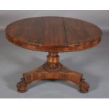 A Regency rosewood breakfast table, having a circular tilt top, split bead rim to the apron, on a