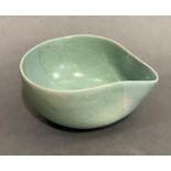 Jane Schaffer pottery stoneware pouring bowl in green with wax-resist pattern, 5.5cm high, marked to