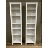 A pair of white finish book cases of six shelves, 49cm wide x 199cm high x 38cm deep