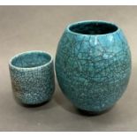 A Simon Leach stoneware studio pottery ovoid vase, raku-fired with a blue lustre glaze and showing