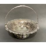 A silver plated on copper fruit basket, the rim cast with shells, leafage and flower heads, bowl