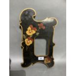 A late Victorian black stained satinwood photograph frame painted with pansies