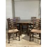 A good reproduction oak oval gate leg dining table having twin drop leaves, ogee arched apron and