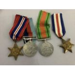 A set of WWII medals including The Defence Medal, The 1935-45 war medal, the France and Germany star