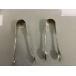 A pair of plain William IV and a pair of plain Victorian silver sugar tongs by William Eley and Hyam