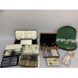 A quantity of boxed silver plated cutlery including tea knives, fish knives and forks, commemorative