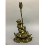 A gilt metal figure of a cherub riding a swan as a table lamp, 35cm to fitting