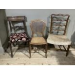 Two 19th century dining chairs and a bergere caned bedroom chair (3)