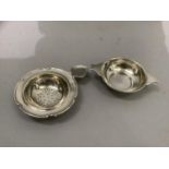 A silver tea strainer, George V, Birmingham 1928, together with a silver quaich/porringer, George V,