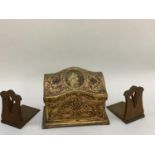 A gilded wood casket and a pair of oak bookends