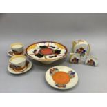 A reproduction Clarice Cliff Crocus style tea for two including teapot, sugar and milk, pair of cups
