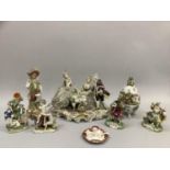A collection of mainly Continental china figures including a group of three, one sat playing a