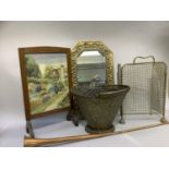 A brass framed wall mirror, coal hod, copper horn and an oak framed and needlework fire screen and a
