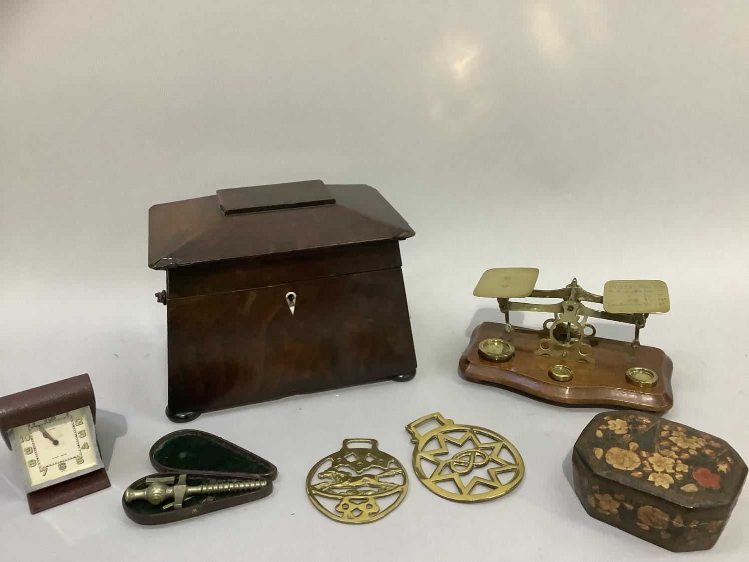 A 19th century sarcophagus tea caddy, postal scales and weights, horse brasses, champagne tap,
