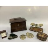 A 19th century sarcophagus tea caddy, postal scales and weights, horse brasses, champagne tap,