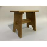 A small pale oak stool on refectory panel supports, made in 1968, 30cm wide x 20cm x 29cm high