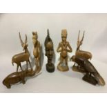A number of wooden carvings of African figures, antelopes, rhinoceros etc