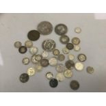 A miscellaneous lot of approximately 4oz of English and foreign silver coins including USA 1833